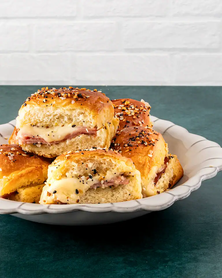 Buttery, filled biscuits topped with seasoning and herbs.