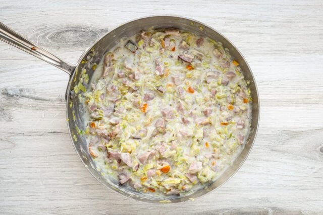 Creamy homemade chicken and vegetable mixture in a skillet.
