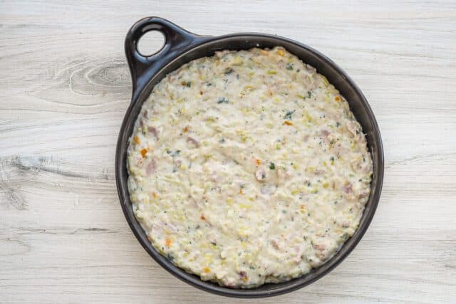 The ham and leek filling is added to the DVF pie plate or baking dish.
