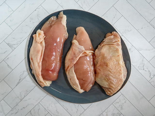 Stuffing the chicken breasts.