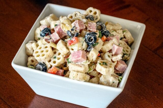 pasta salad with marinated artichokes, ham, and olives