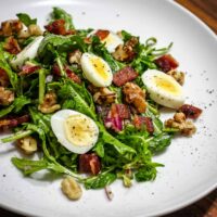 A simple salad with hard boiled quail eggs.