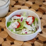a bowl of salad with homemade buttermilk dressing