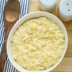 Creamy potato salad with chopped eggs and black pepper.
