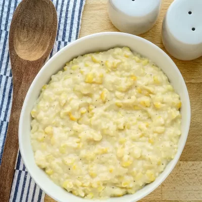 Creamy potato salad with chopped eggs and black pepper.