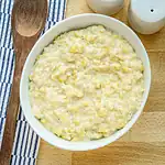 Creamy mashed potatoes with butter and seasoning.