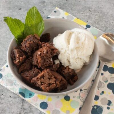 hot fudge cake cut into squares and served with vanilla ice cream
