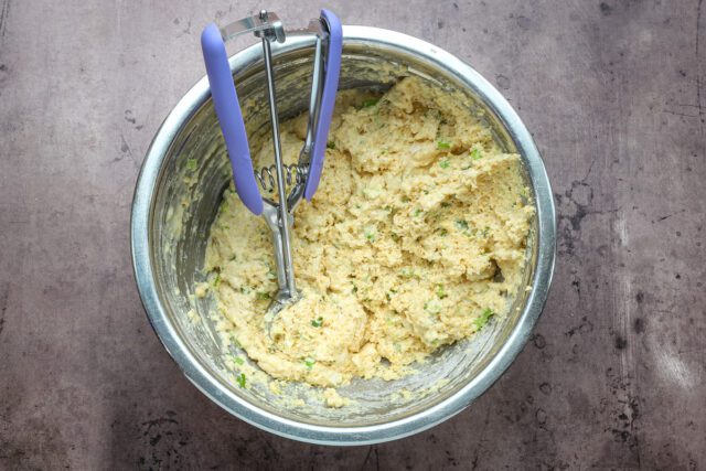 Hushpuppy preparation: making the batter with buttermilk and green onions.