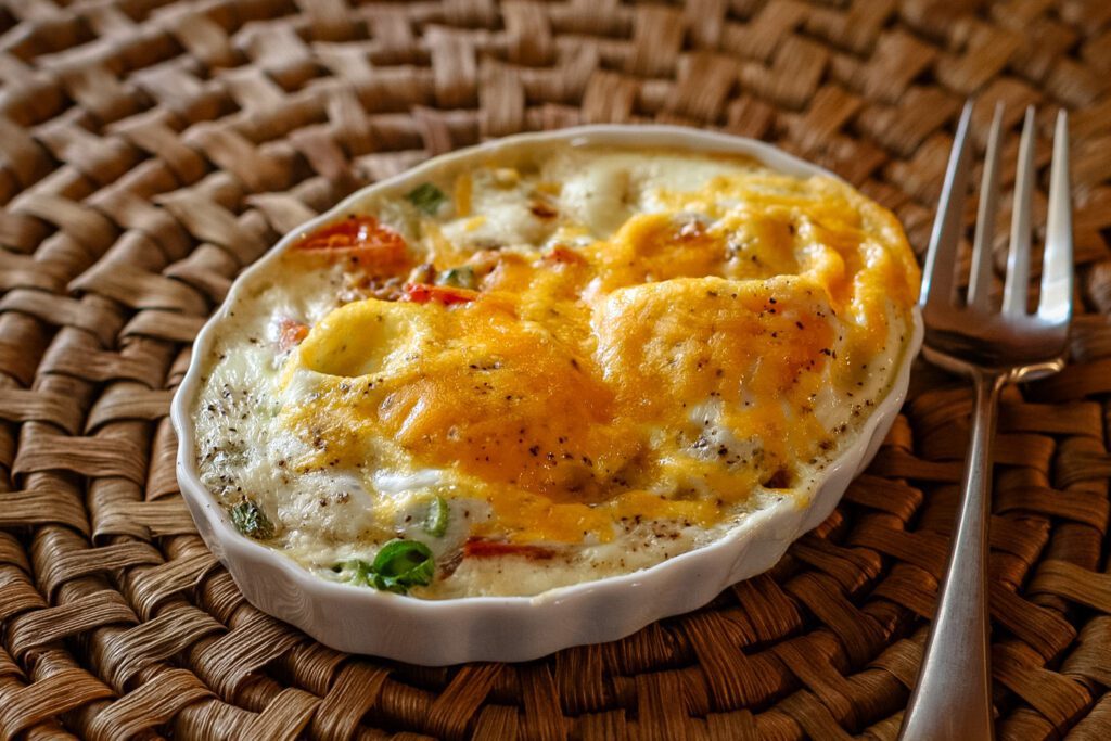 individual breakfast bake in a shallow ramekin