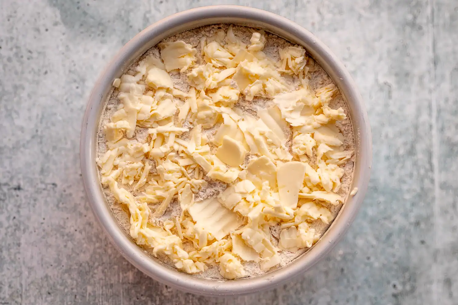 Butter added to the pan for Instant Pot apple dump cake.