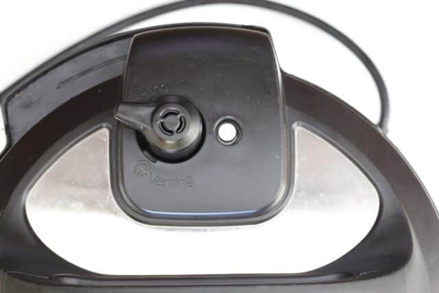 Instant Pot lid with vent in the sealing position. Testing the Instant Pot ham with an instant-read thermometer.