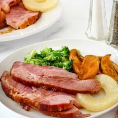 Glazing the Instant Pot ham for a quick finish in the oven.