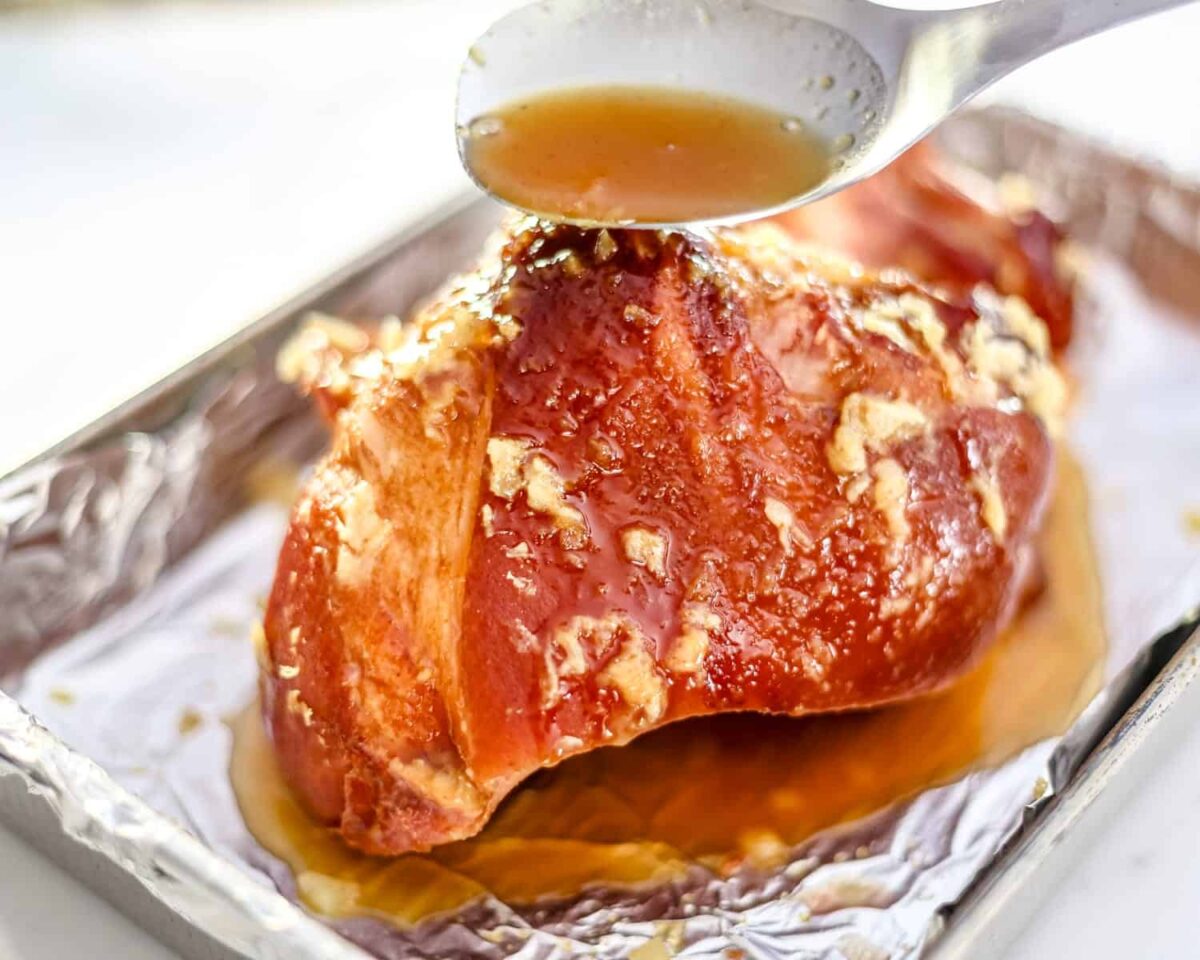 Finishing the Instant Pot baked ham with glaze.