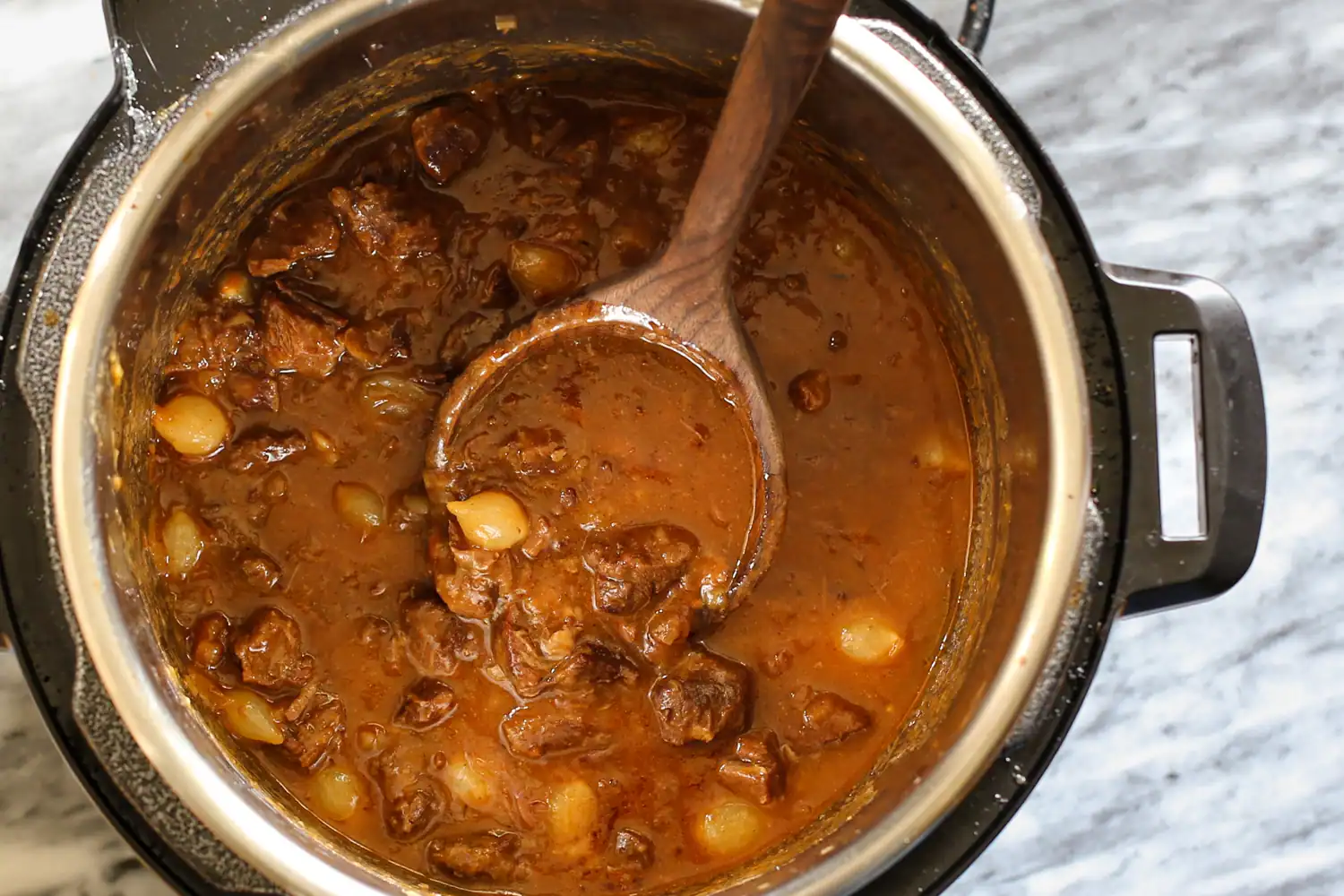The Instant Pot with beef and beer stew, beef carbonnade.