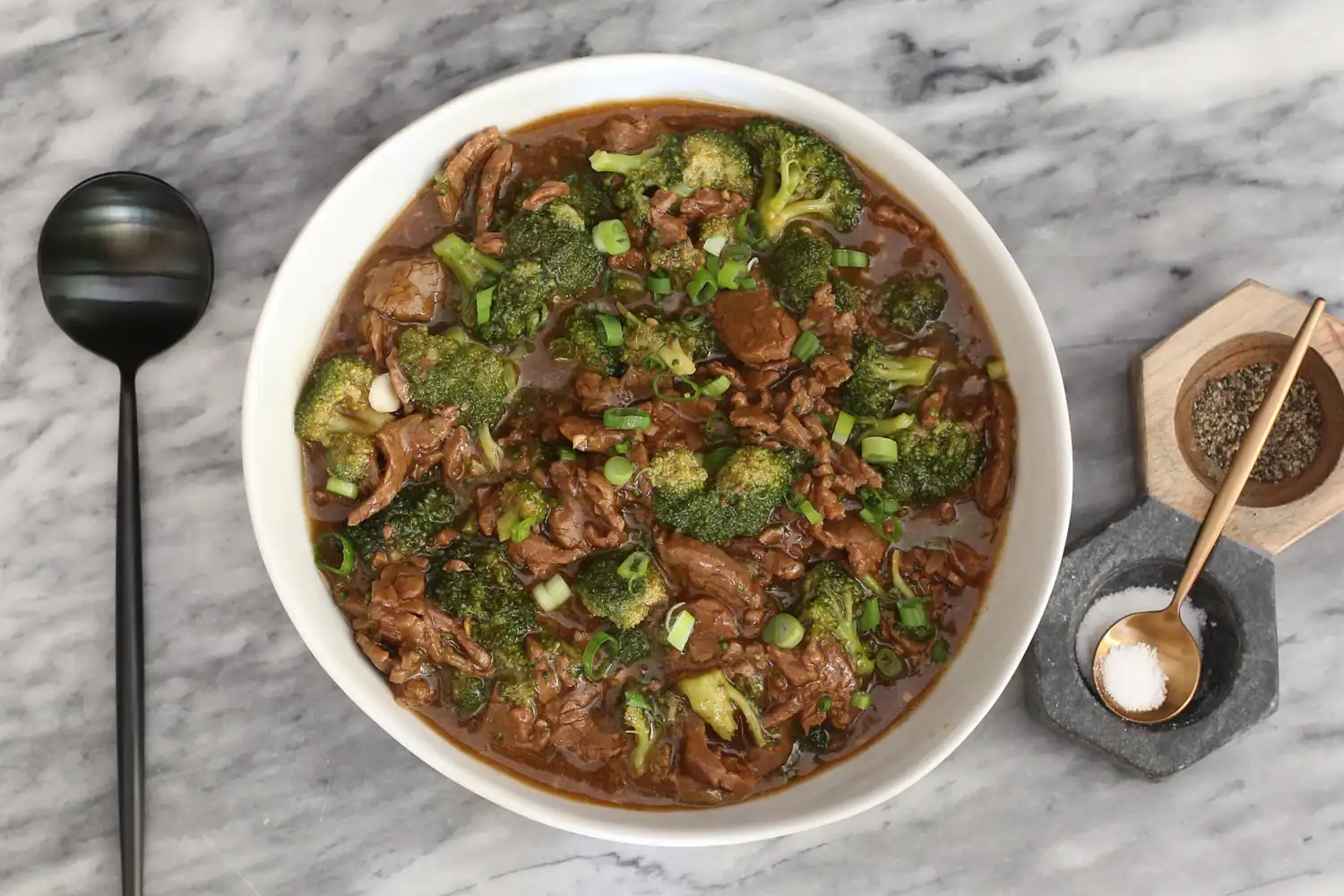A serving bowl with beef and broccoli that was cooked in the Instant Pot.