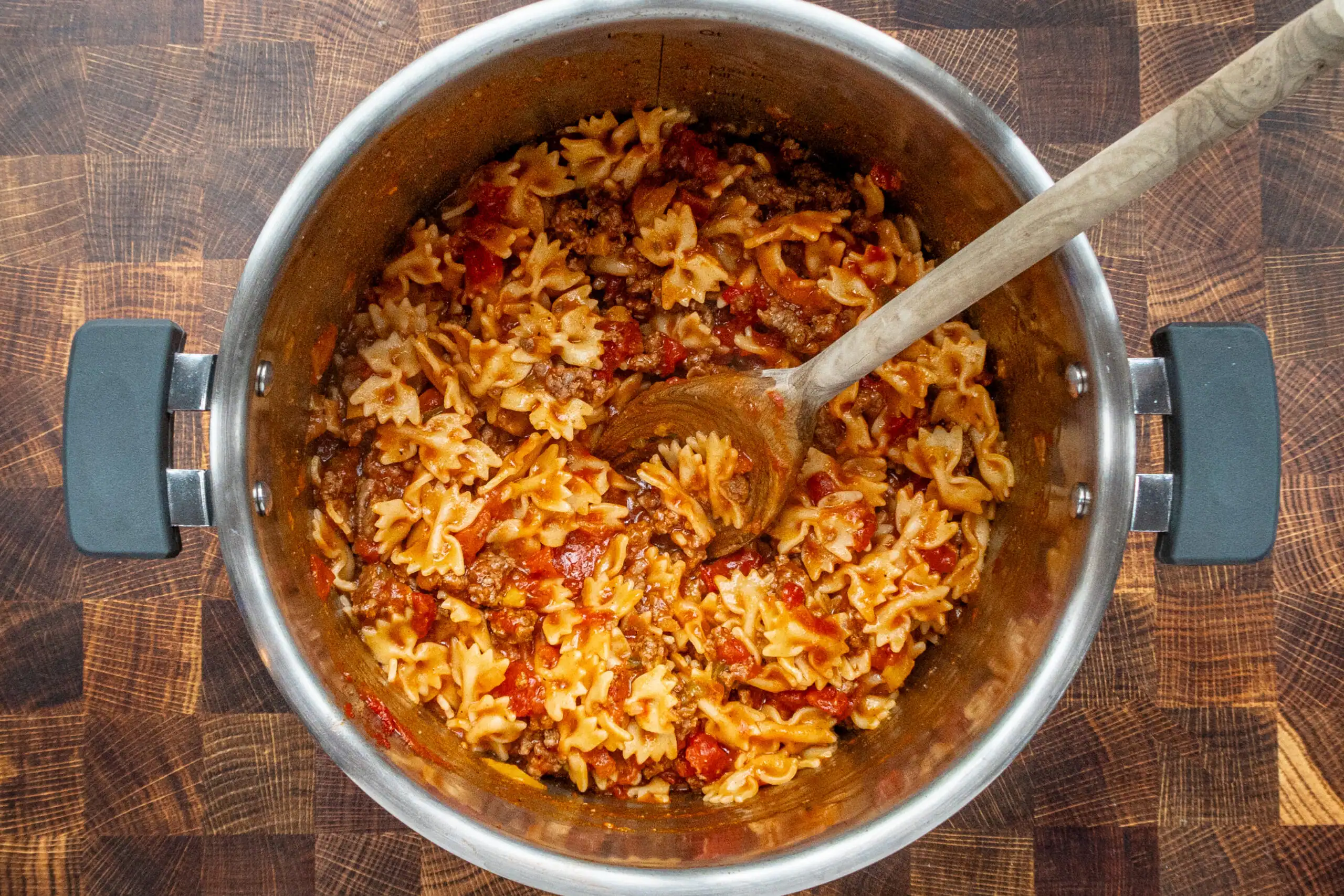 Instant Pot farfalle pasta prep: finishing the dish with tomato paste and seasonings.