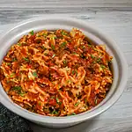 Baked pasta with ground beef and tomato sauce.