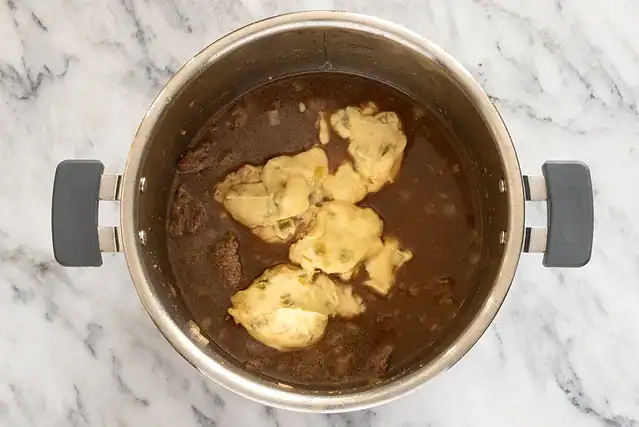 Liquids and condensed soup added to the Instant Pot beef tips.