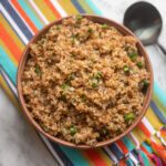 instant pot bulgur pilaf in a bowl with spoon