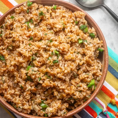Fried rice with chopped green onions and savory sauce.
