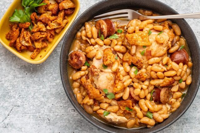 instant pot cassoulet with beans, chicken thighs, bacon, and smoked sausage