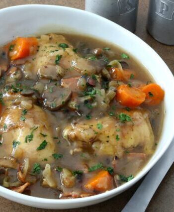 instant pot chicken with bacon and wine in a serving bowl