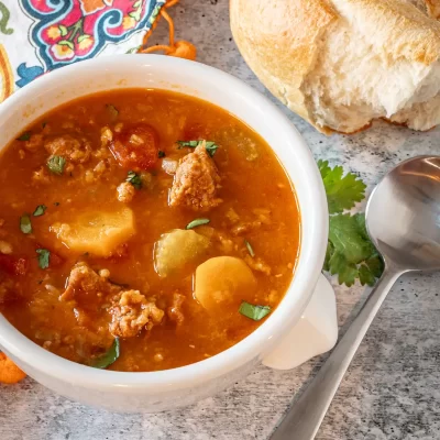 Creamy vegetable beef soup with potatoes and carrots.