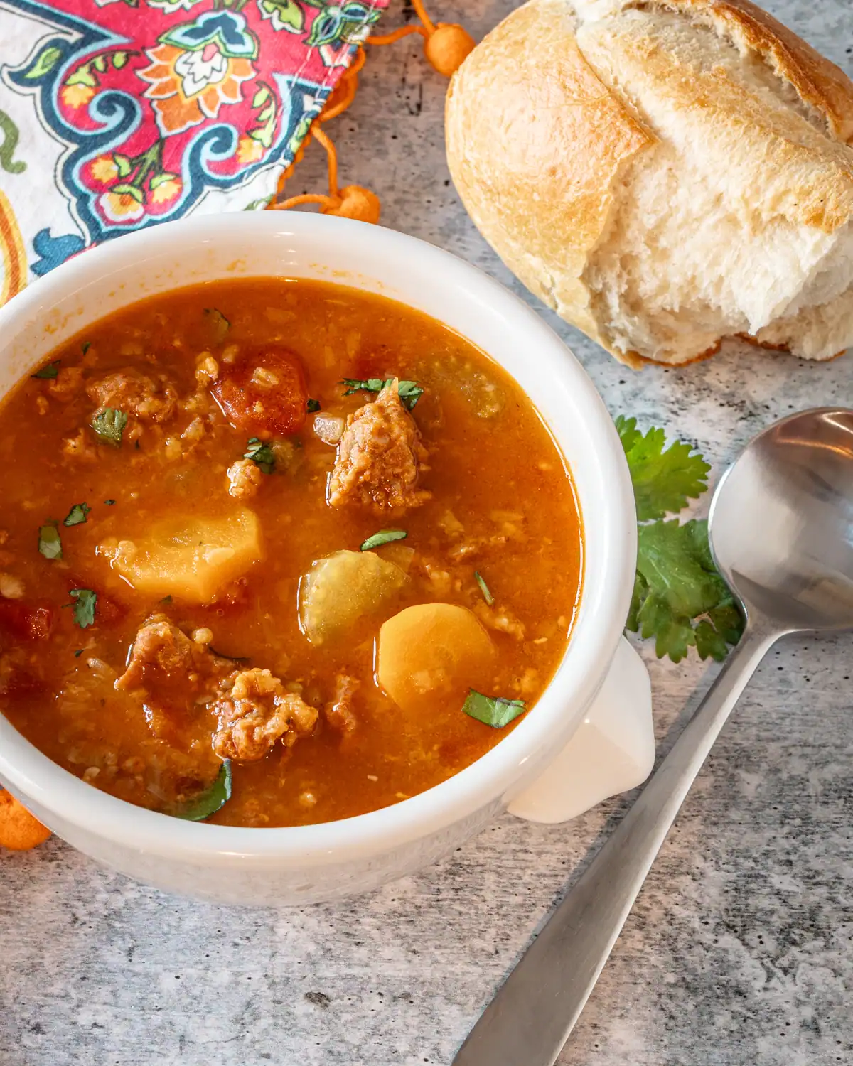 Creamy vegetable beef soup with potatoes and carrots.