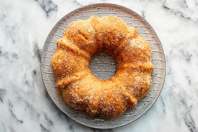 Instant Pot doughnut cake with cinnamon sugar topping.