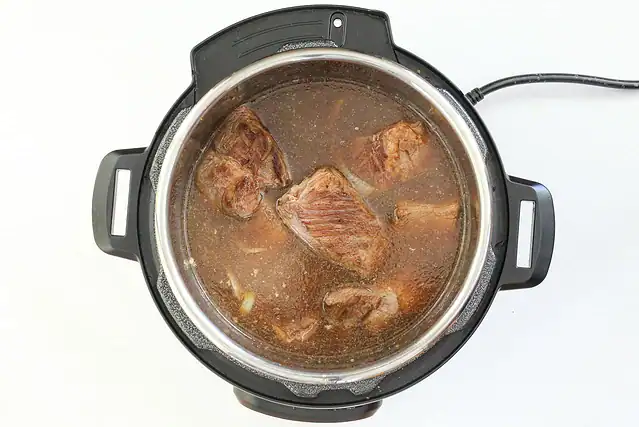Cooking the beef in the Instant Pot.