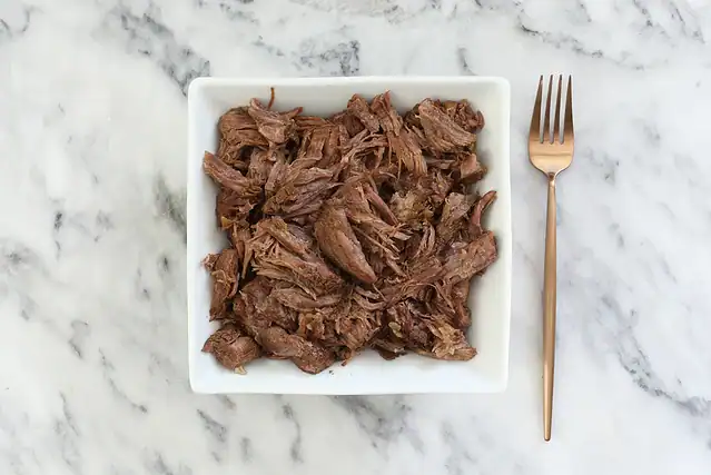 Shredded beef for French dip sandwiches.
