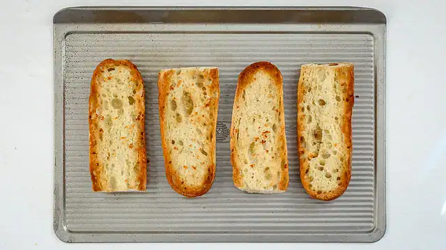 Toasting the rolls for French dip sandwiches.