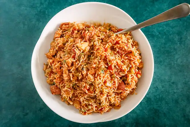 A serving bowl of Instant Pot jambalaya with chicken and spicy sausage.