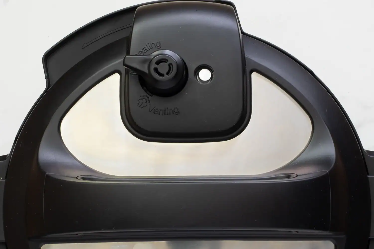 Pressure cooker lid in the sealing position.