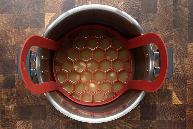 Trivet and liquids in the Instant Pot.