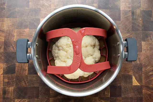 Cooked head of cauliflower in the Instant Pot.