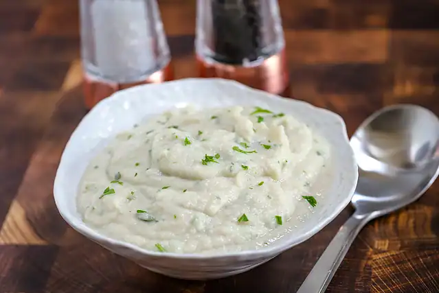A serving bowl of Instant Pot mashed cauliflower.