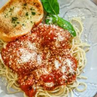 A plate of spaghetti with Instant Pot meatballs and sauce.