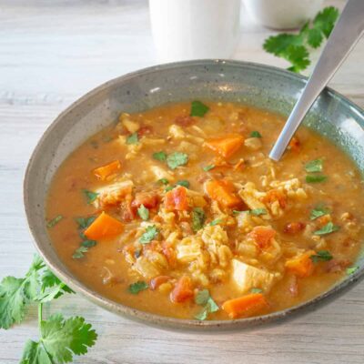 A bowl of chicken mulligatawny soup cooked in the Instant Pot pressure cooker.