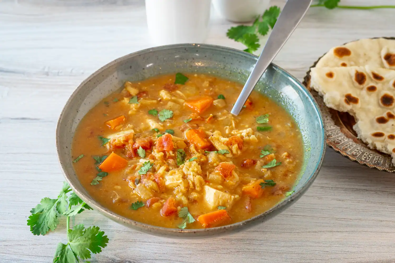 A bowl of chicken mulligatawny soup cooked in the Instant Pot pressure cooker.