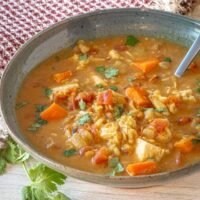 A bowl of chicken mulligatawny soup cooked in the Instant Pot pressure cooker.
