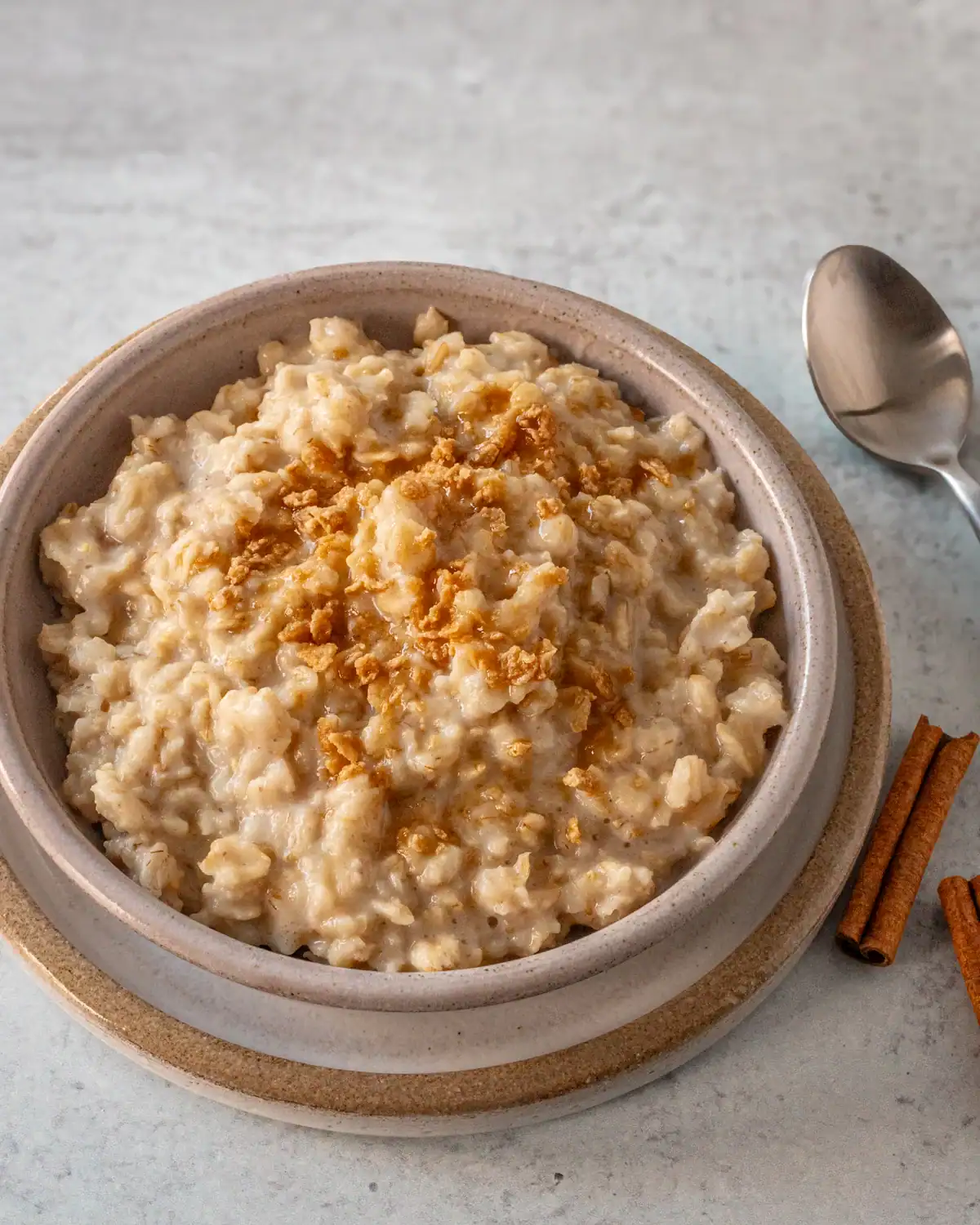 Creamy oatmeal topped with a sprinkle of cinnamon crumbs.