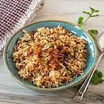 This Instant Pot Parsi rice is flavored with caramelized onions and warm spices. It's a delicious Persian dish with Indian influences.