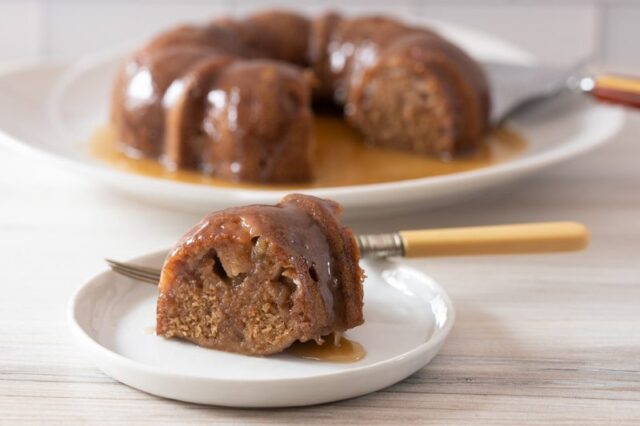 instant pot pear cake, sliced with the whole cake in the background