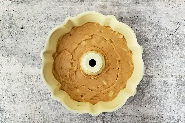 Batter in the small fluted cake pan for the Instant Pot pear cake.
