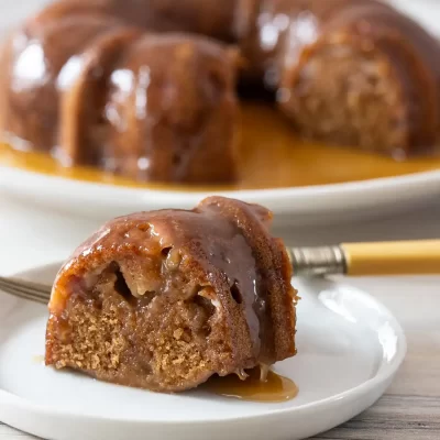 Rich caramel apple bread pudding drizzled with caramel sauce.
