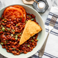 pinto beans with cornbread in a wide bowl.