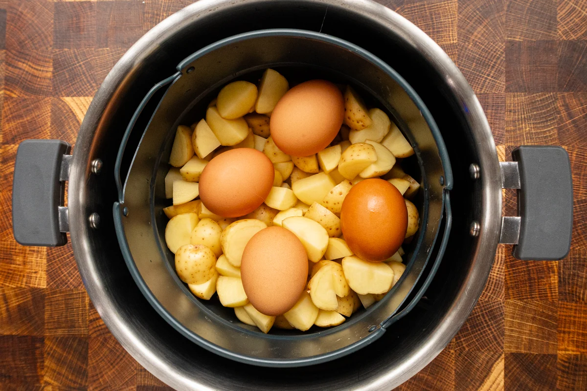 Potato salad prep: cubed potatoes and eggs in the Instant Pot.