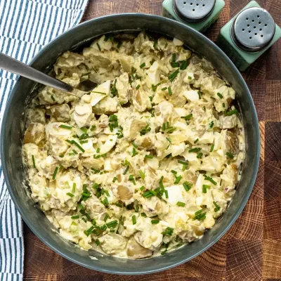 Creamy potato salad with chopped chives.