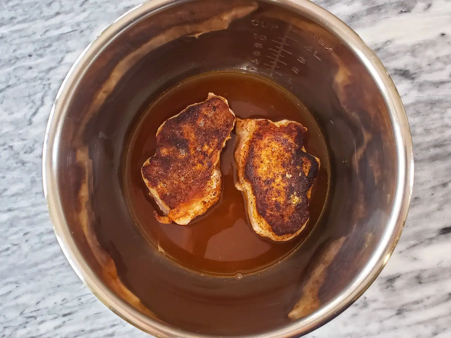 Deglaze the pan and add the chops.
